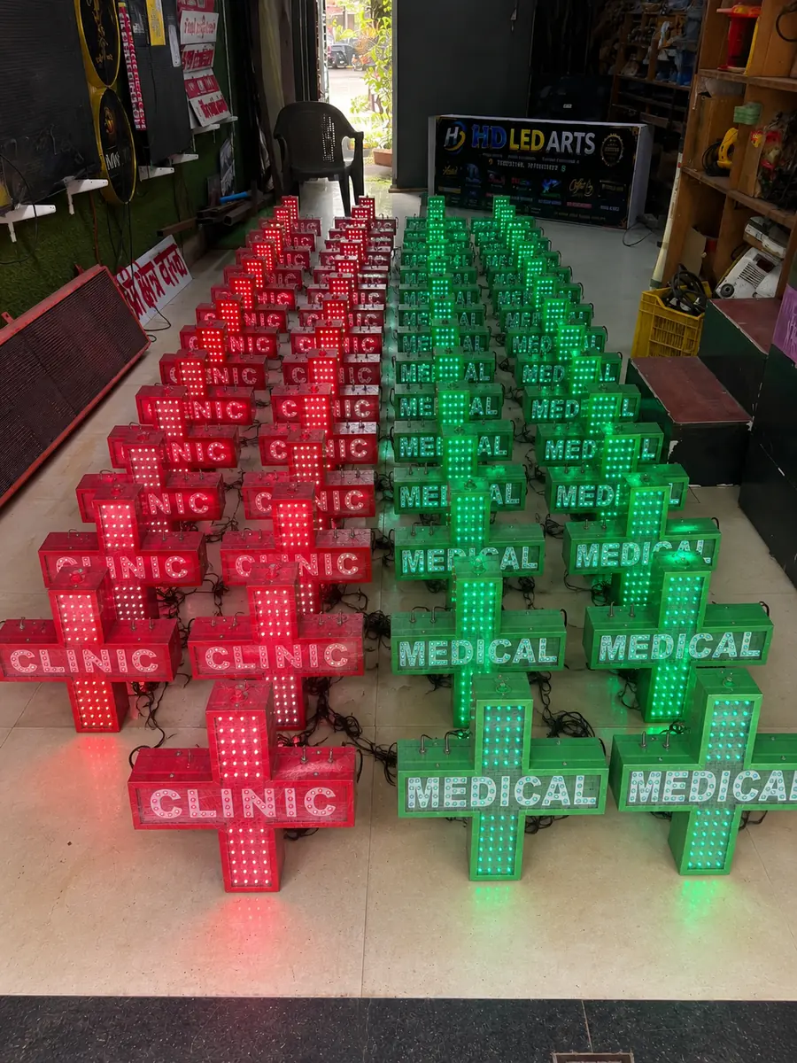 Rows of green MEDICAL and red CLINIC LED cross signs kept in ready stock for quick dispatch